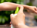Person spraying a child’s wrist