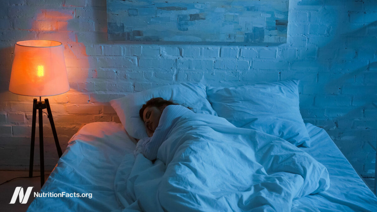 Person wrapped up in bed sleeping