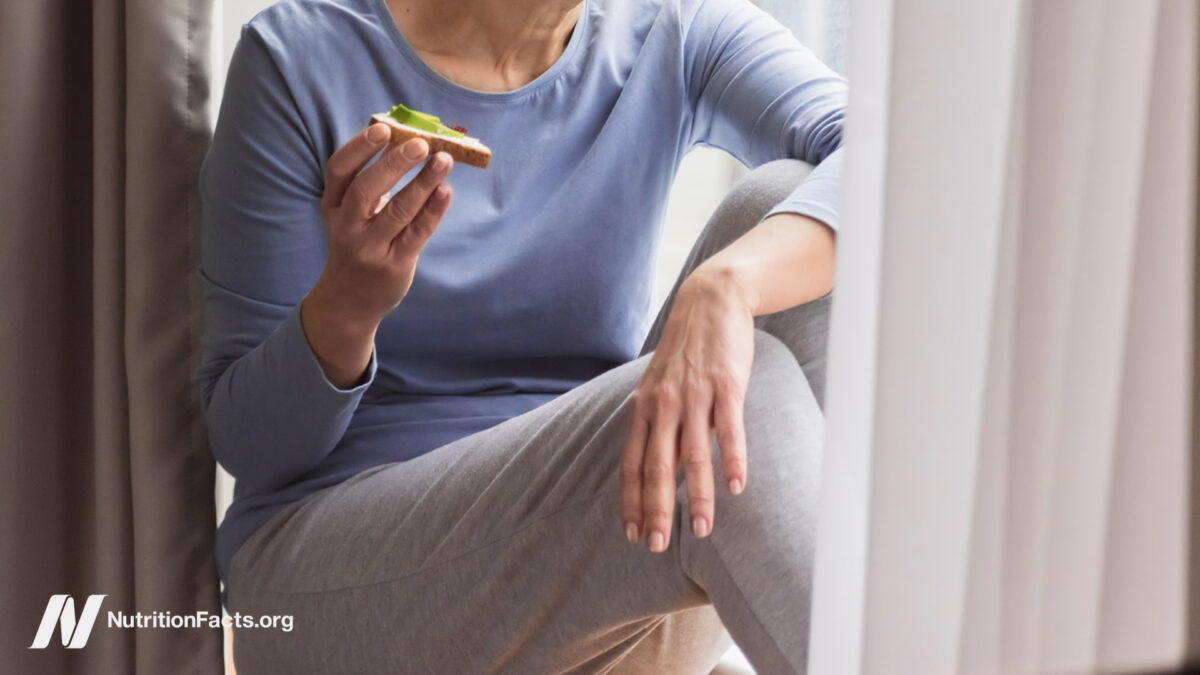 Woman eating avocado toast