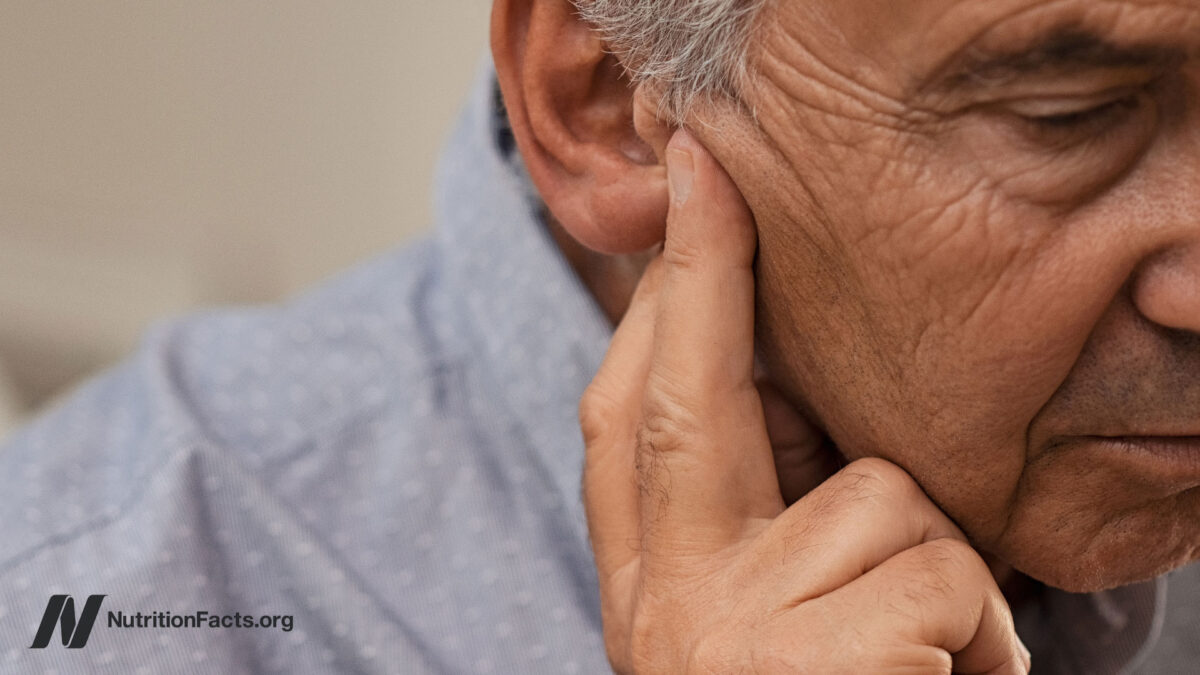 Senior man with hearing problems