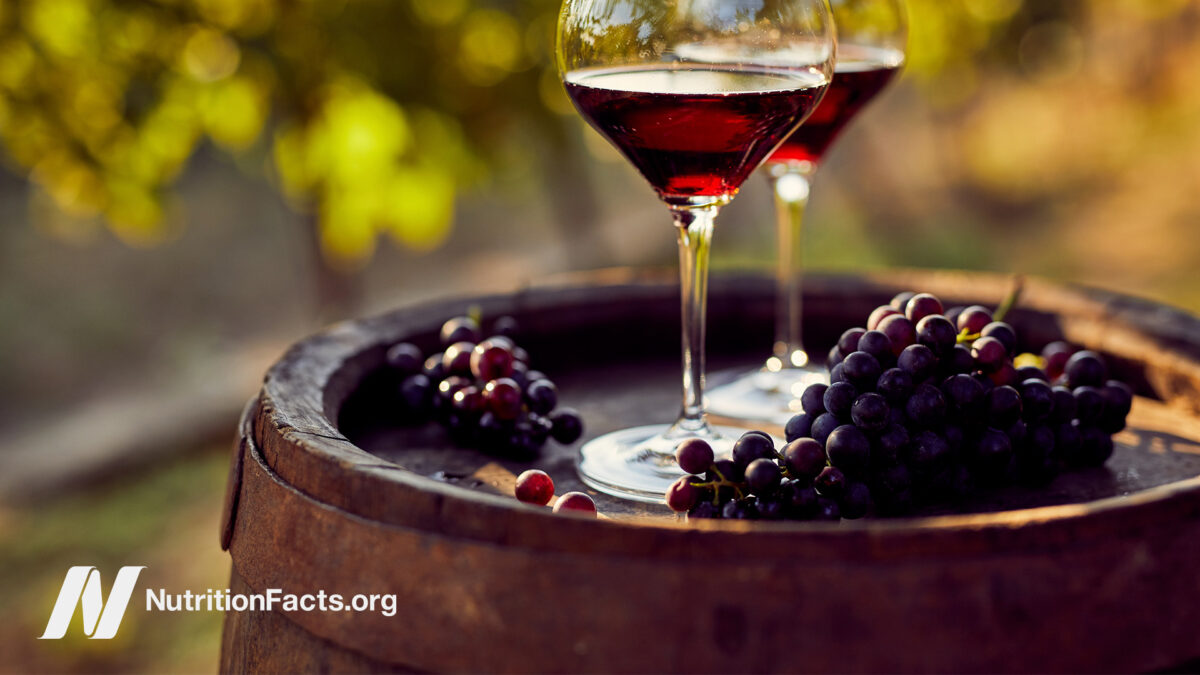 Grapes and glasses of red wine