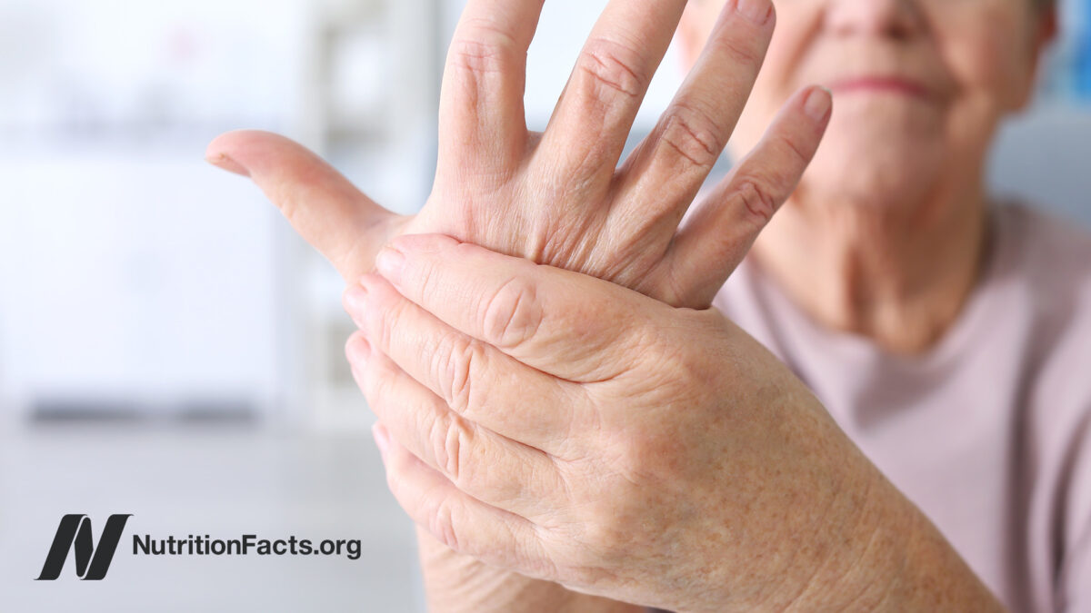 Woman holding aching hands