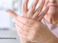 Woman holding aching hands