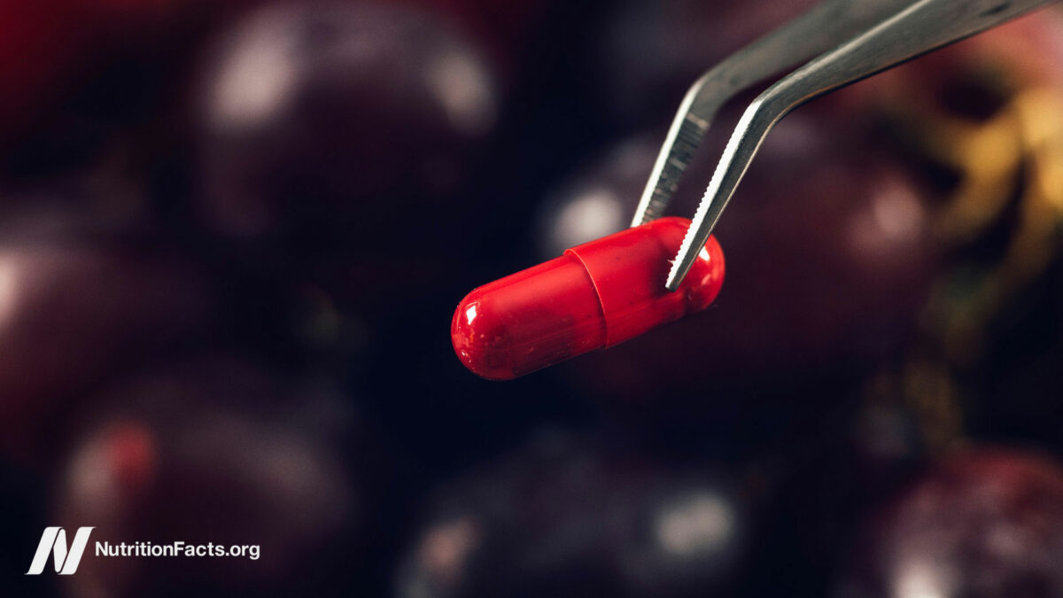 A red supplement capsule