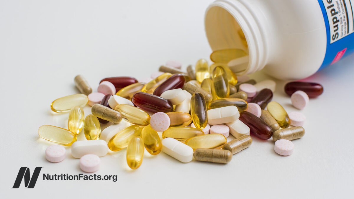 Multivitamins spilling out of a jar