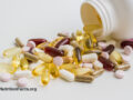 Multivitamins spilling out of a jar