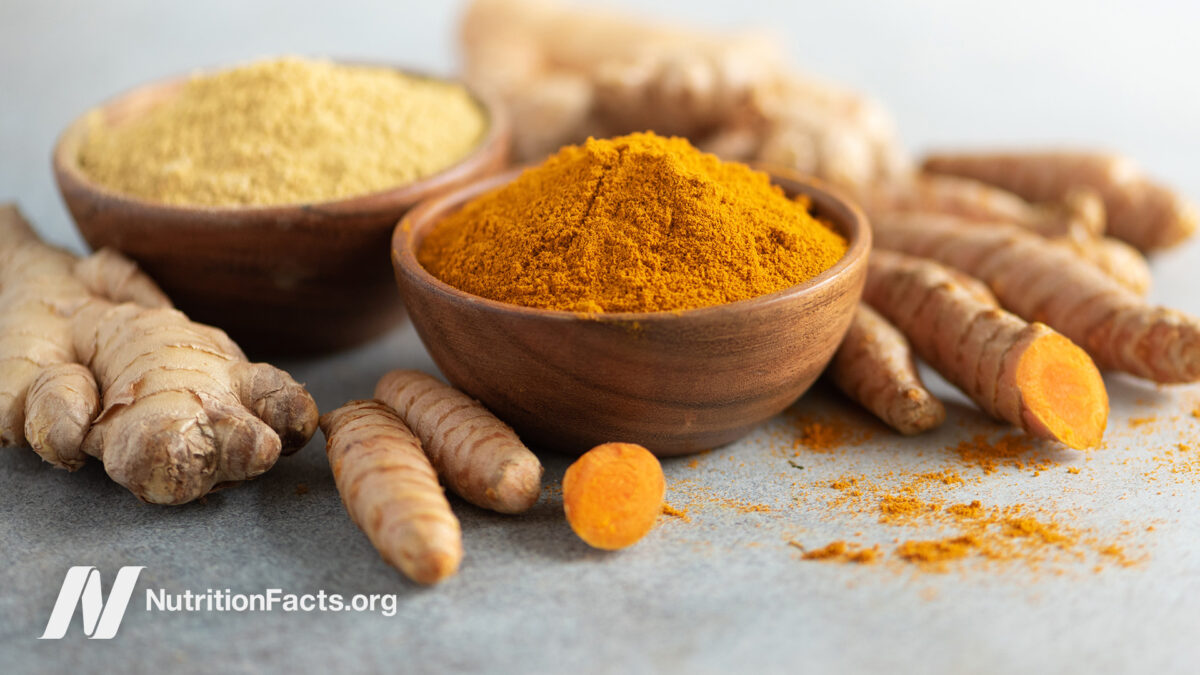 Turmeric and ginger powdered in bowls