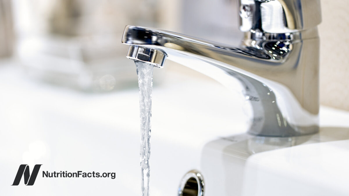 chrome faucet with water running