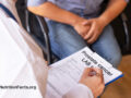 Doctor and patient reviewing prostate test lab results