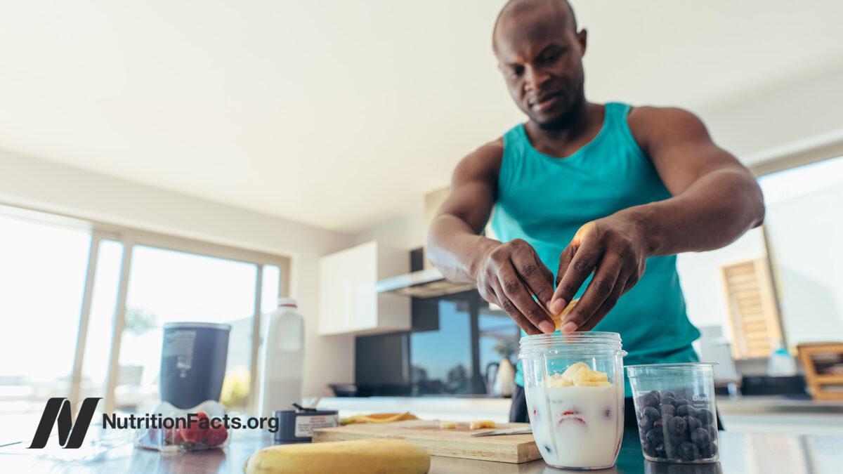 Man making a smoothie after exercising