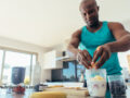 Man making a smoothie after exercising