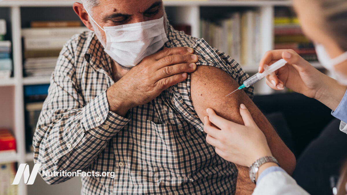 Older patient receiving a vaccination