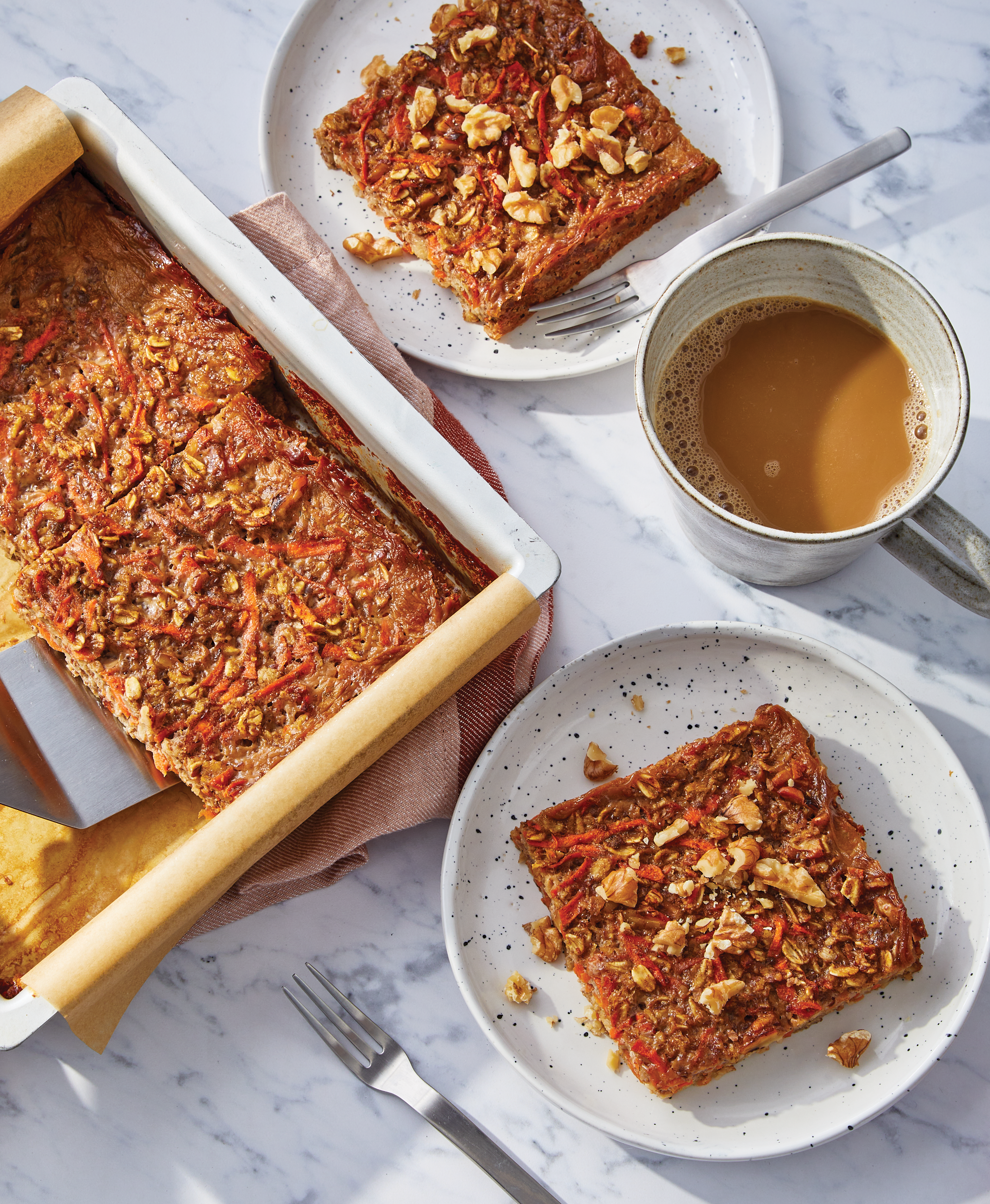 baking dish and side dishes with baked carrot cake oatmeal on them
