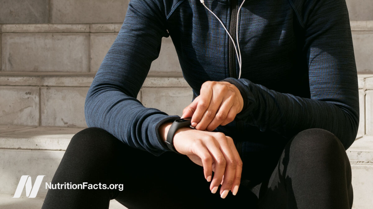 Woman checking her fitness tracker on her wrist