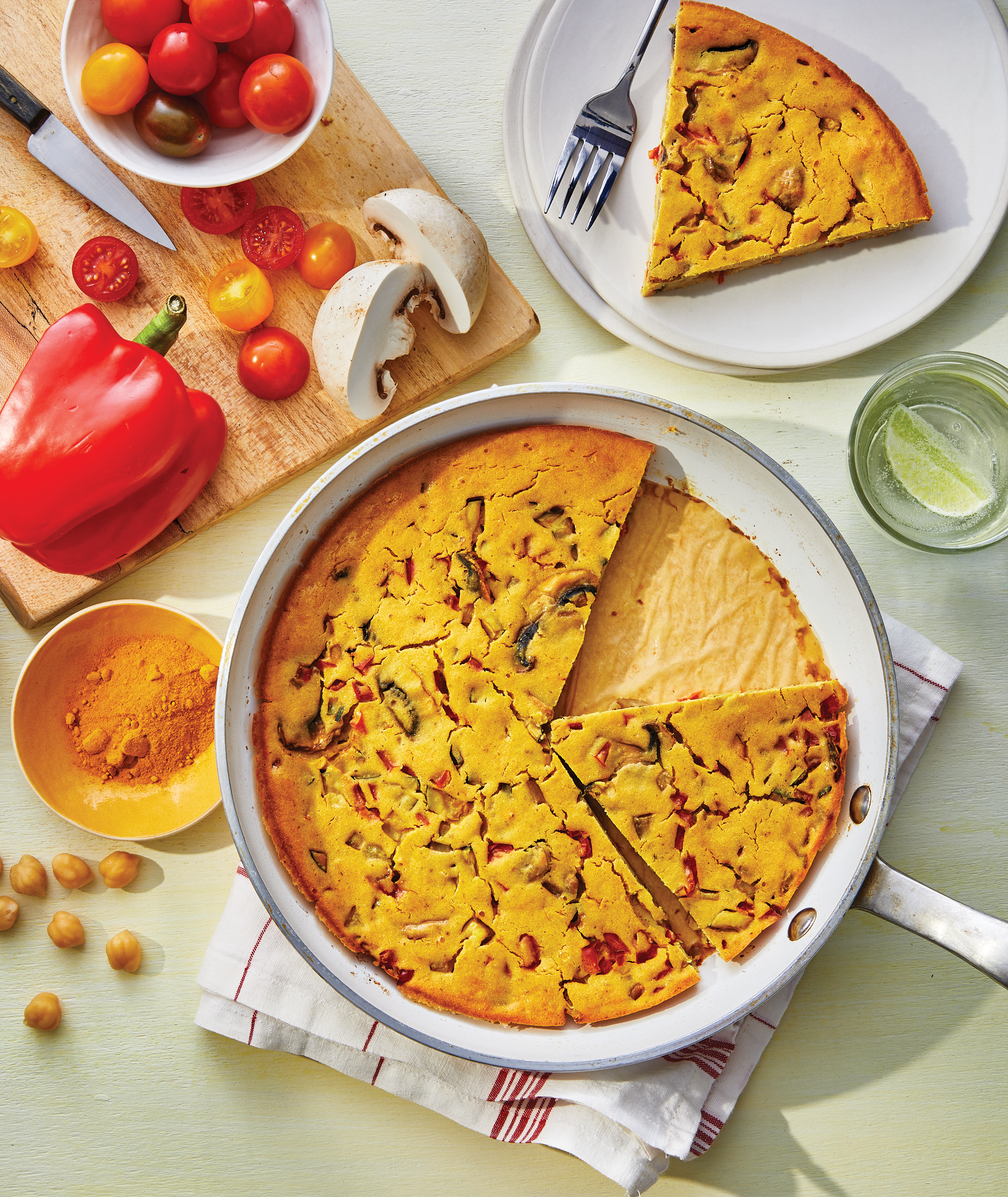skillet with frittata, and a plate with a slice on it