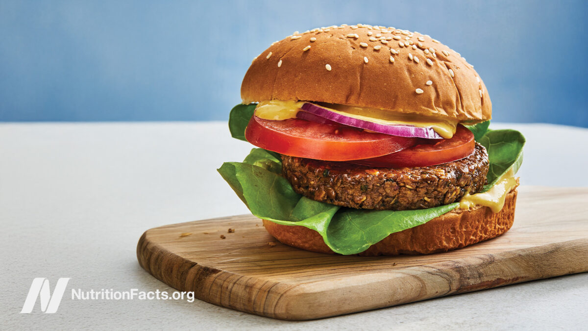 Lentil-Walnut burger on a wooden cutting board