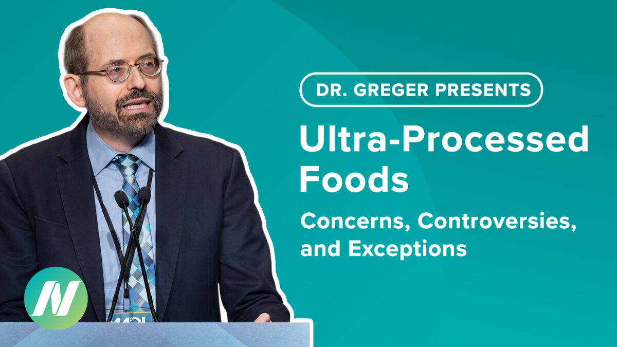 Dr Greger behind a lecturn
