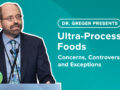 Dr Greger behind a lecturn