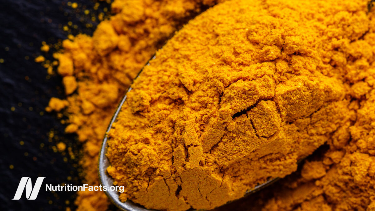 Powdered turmeric on a spoon
