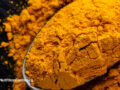 Powdered turmeric on a spoon