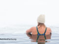 Woman in an outdoor cold body of water