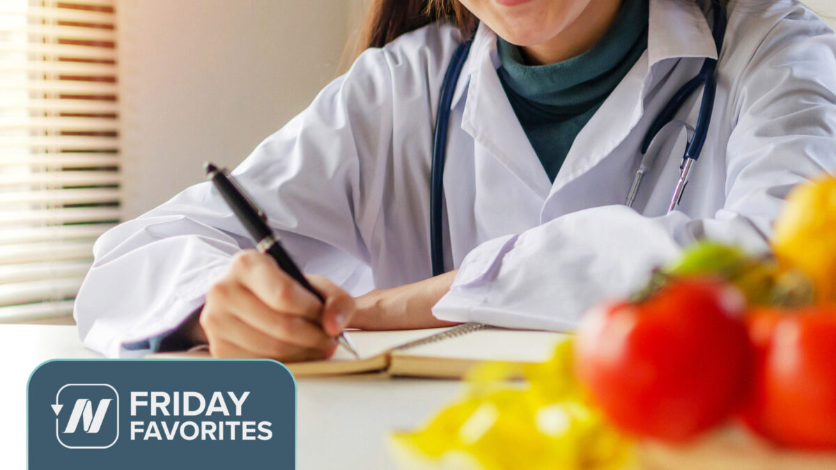 Medical professional writing in notebook