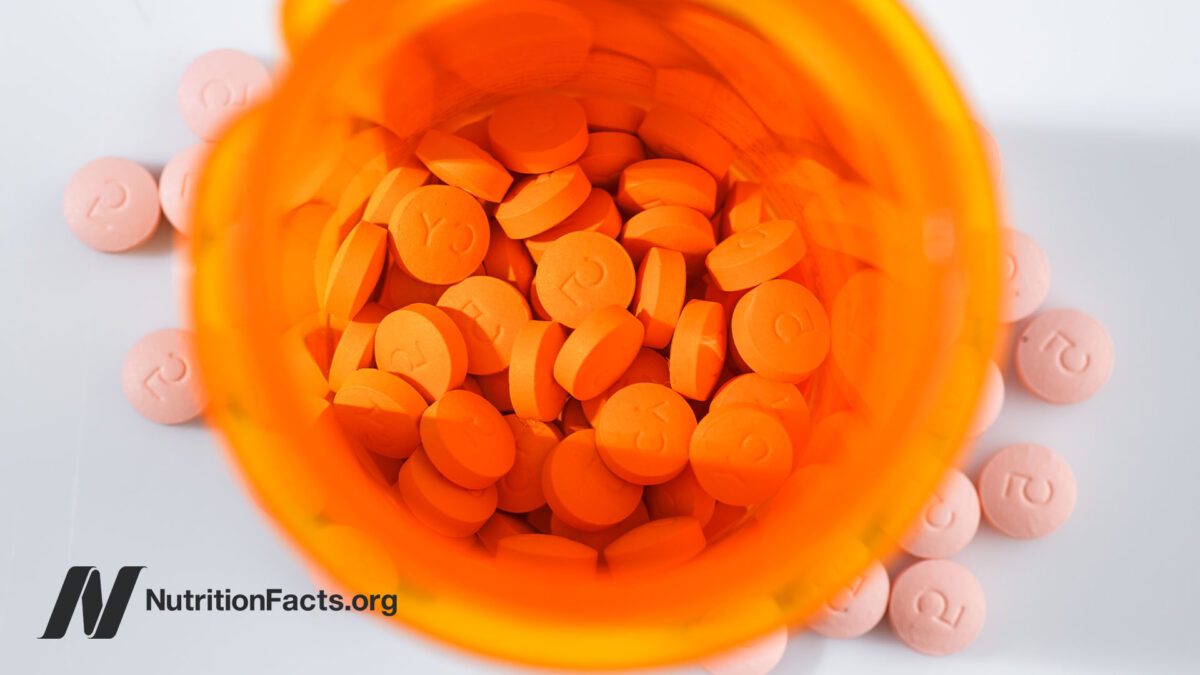 Overhead view of a pill bottle with statin drugs