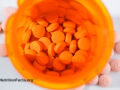 Overhead view of a pill bottle with statin drugs