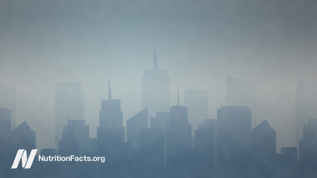 Landscape view of a polluted city with tall buildings and skyscrapers