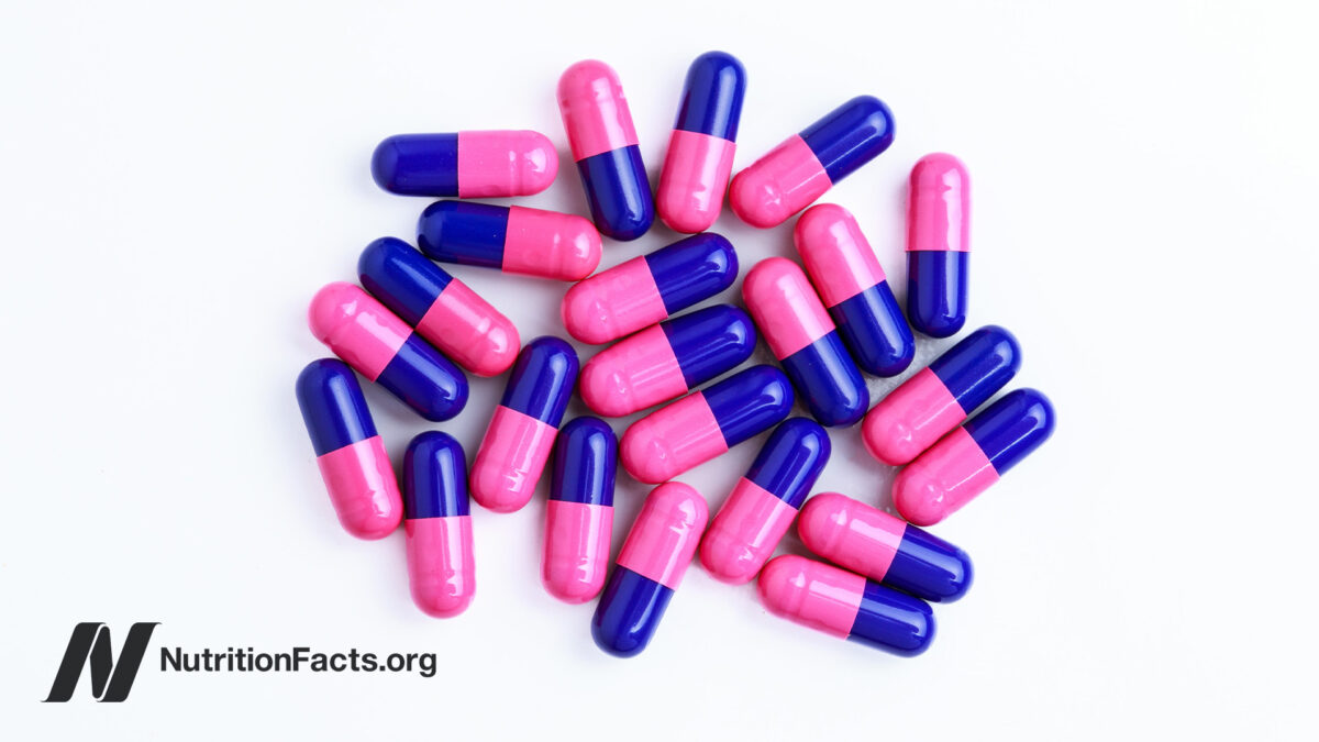 Overhead view of proton pump inhibitor pill capsules that are pink and blue