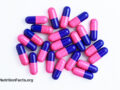Overhead view of proton pump inhibitor pill capsules that are pink and blue